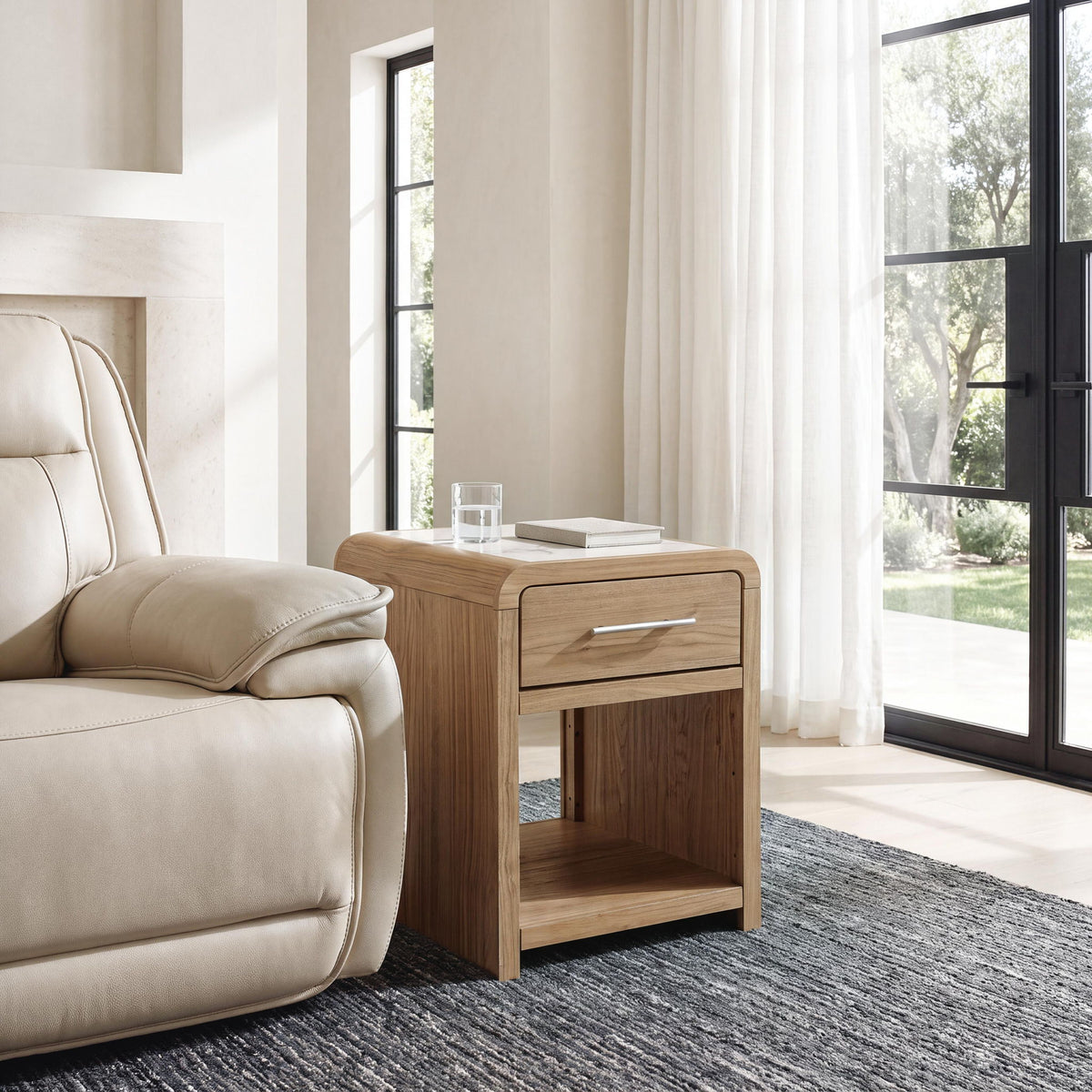 Light brown rectangular end table with drawer and open shelf, curved corners