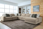 Light brown sectional sofa with chaise end and striped throw pillows