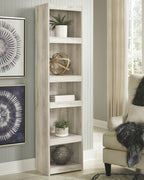 Whitewash wood bookcase with four open shelves, styled with decor and books