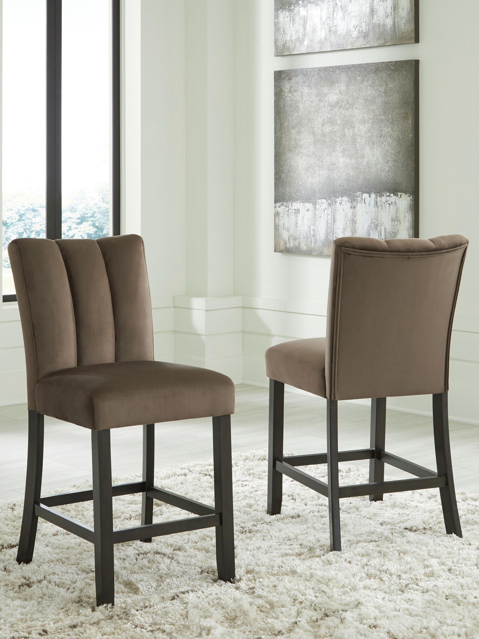 Mocha upholstered barstool with tall padded back, cushioned seat, and dark wooden legs