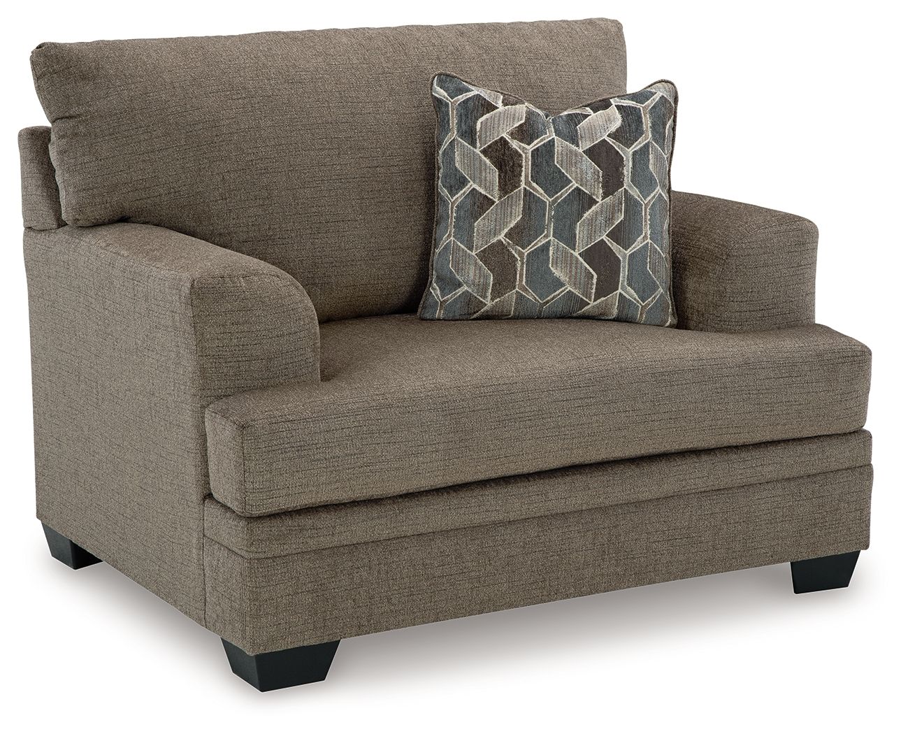 Beige chair-and-a-half armchair with dark geometric patterned accent pillow