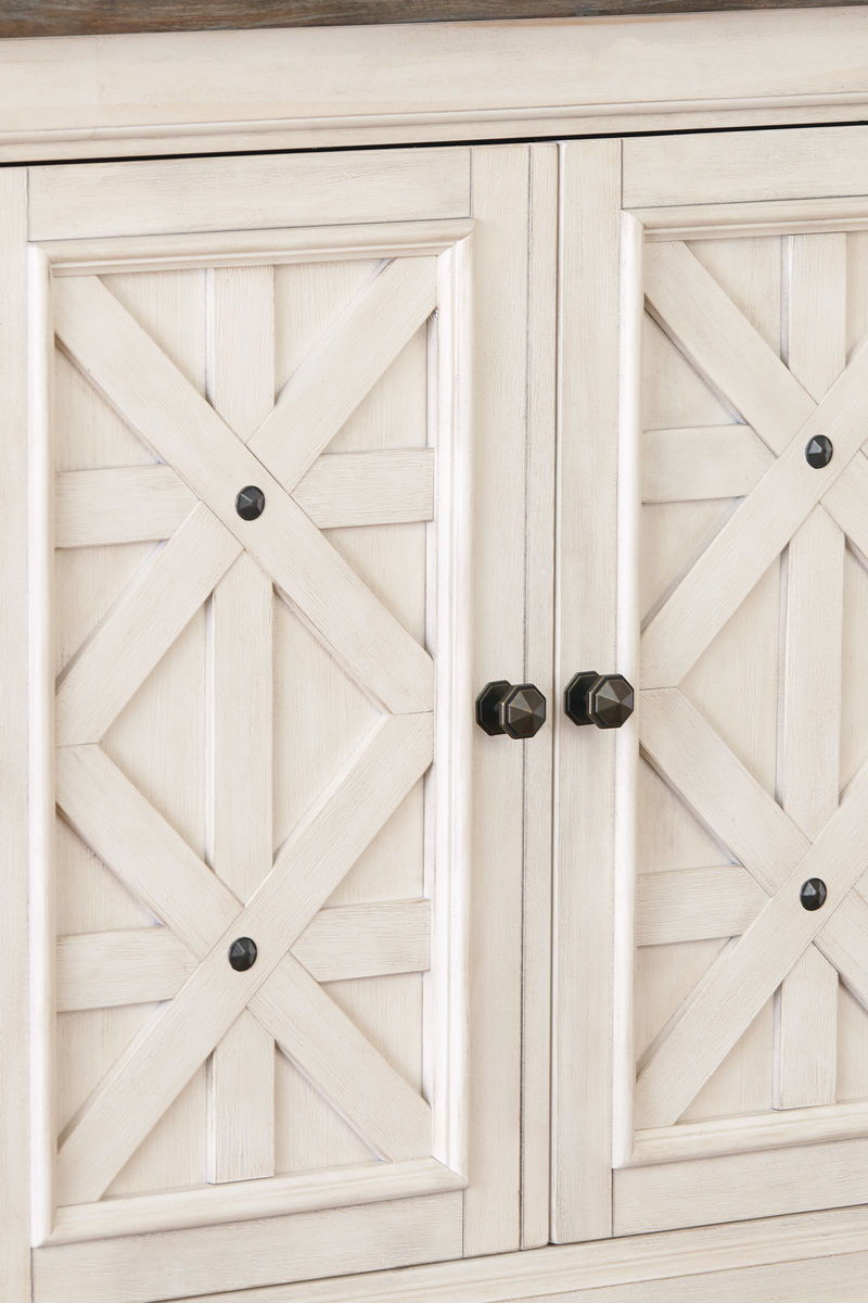Beige buffet cabinet doors with diamond panel details and round knobs