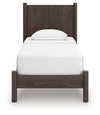 Dark brown panel platform bed frame with white mattress and rounded pillow