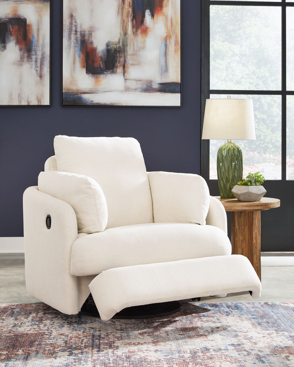 Swivel glider recliner chair in white fabric, padded arms and supportive backrest.