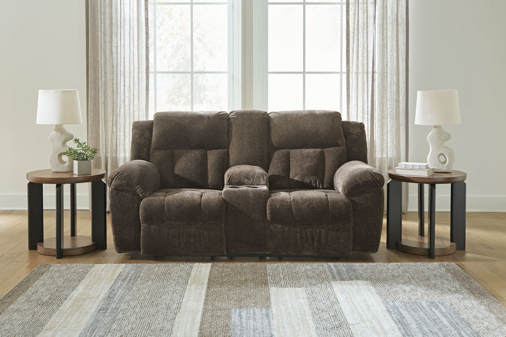Dark brown double reclining loveseat with rounded arms and tufted back cushions