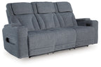 Steel gray power reclining sofa with padded armrests and three seat sections