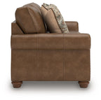 Chasemore sofa in tan with patterned throw pillow and boxy seat cushions