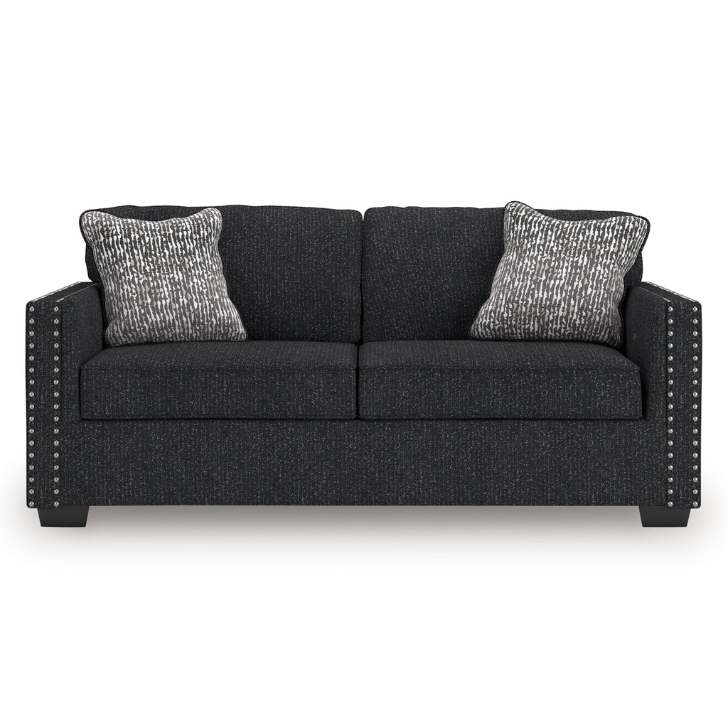 Coal fabric sofa with nailhead trim, arm details, and two heather gray throw pillows