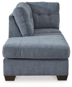 Blue fabric corner chaise end with rounded tufted back and thick seat cushion