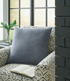 Light blue square throw pillow with plain woven fabric and stitched edges