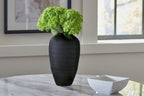 Etney vase, dark gray textured ceramic, tall tapered shape holding green stems