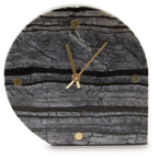 Table clock front, dark gray arched face with gold hands, striped texture, and dots