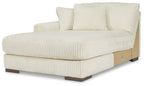 Ivory ribbed corner chaise with rolled arms, back cushions, and block feet