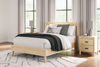 Platform panel bed with light beige wood headboard and white bedding with gray throw