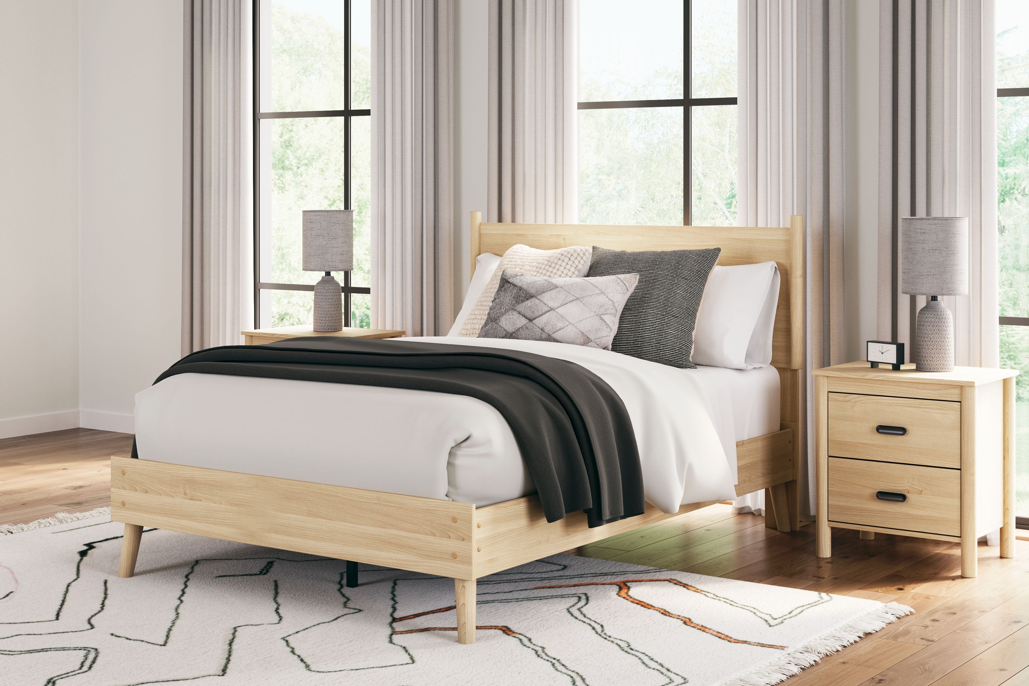 Platform panel bed with light beige wood headboard and white bedding with gray throw