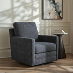 Dark gray swivel accent chair with padded arms and tall backrest in a room.