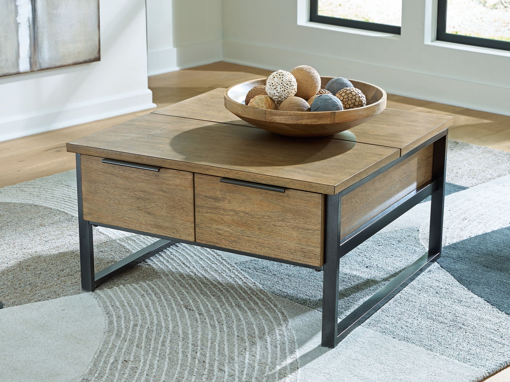 Light brown wood table with two drawers and black metal legs, bar pulls