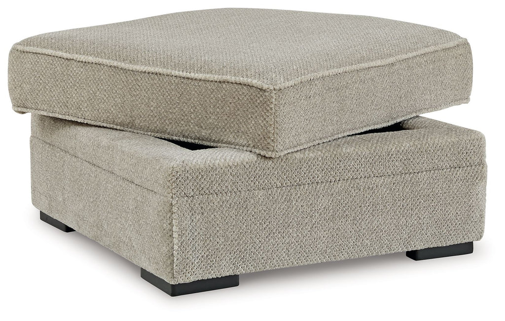 Light beige fabric storage ottoman with hinged lid and black feet