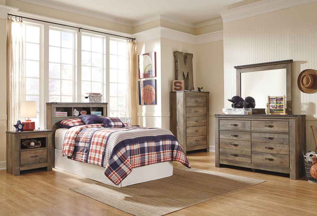 Youth bookcase headboard with dark brown shelves, plaid bedding and pillows