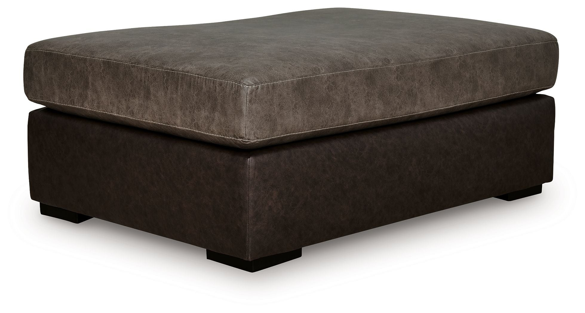 Oversized accent ottoman with square padded top, dark brown fabric, low wooden feet.