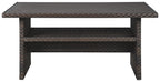 Dark brown multi-use table with beige woven accents, shelf and open base