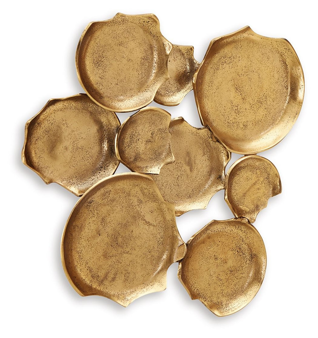 Antique gold wall decor of embossed metal leaf plaques, curved discs, scattered