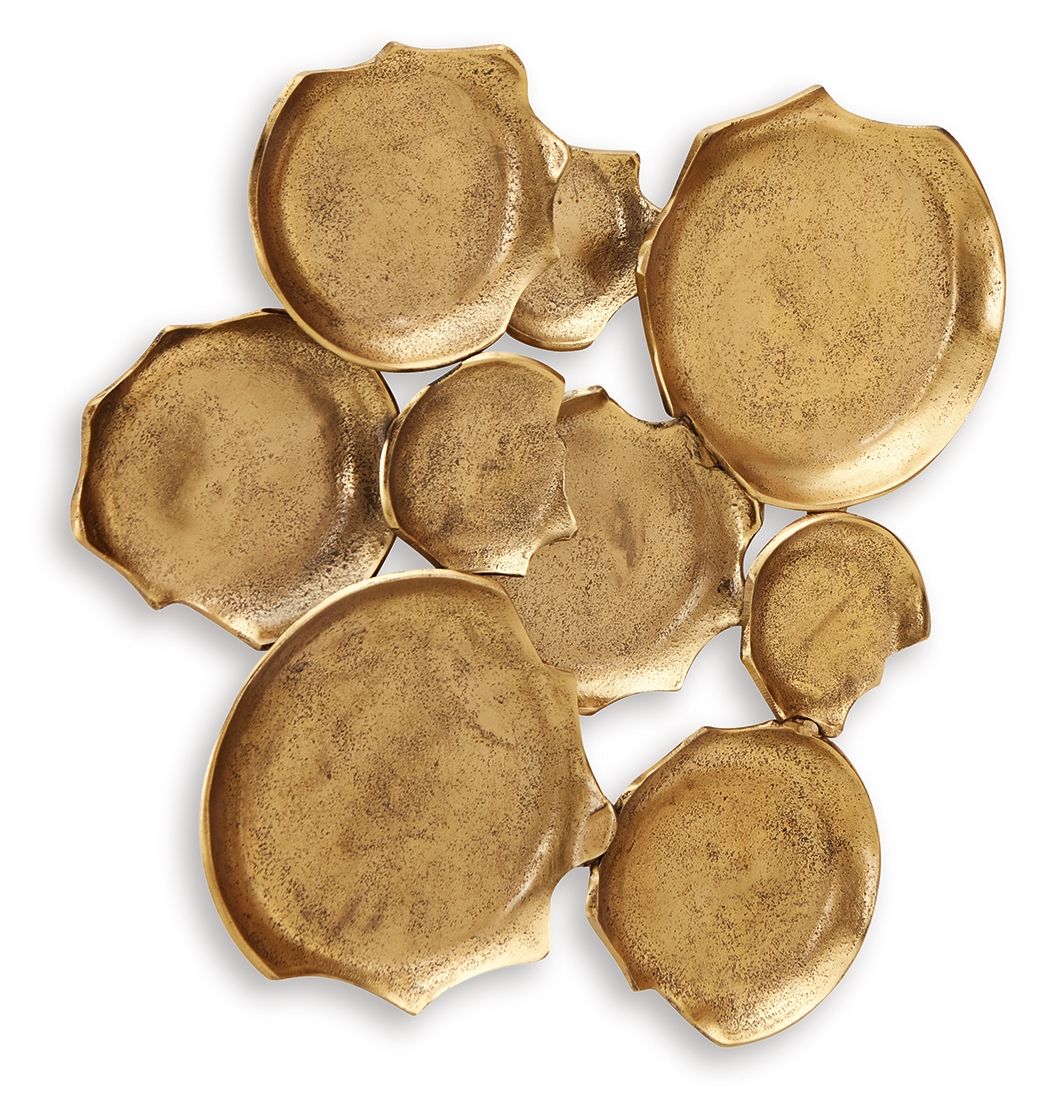 Antique gold wall decor of embossed metal leaf plaques, curved discs, scattered