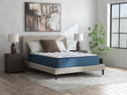 Plush mattress with white patterned cover and blue base on modern bed frame