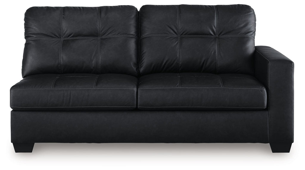Dark sofa with tufted back, smooth seat, and square padded arms with legs