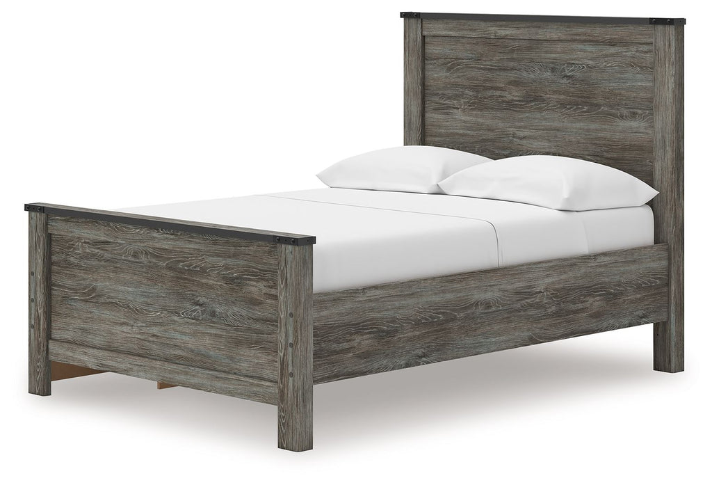 Gray wood panel bed with low profile, one side angle, and two white pillows