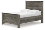 Gray wood panel bed with low profile, one side angle, and two white pillows