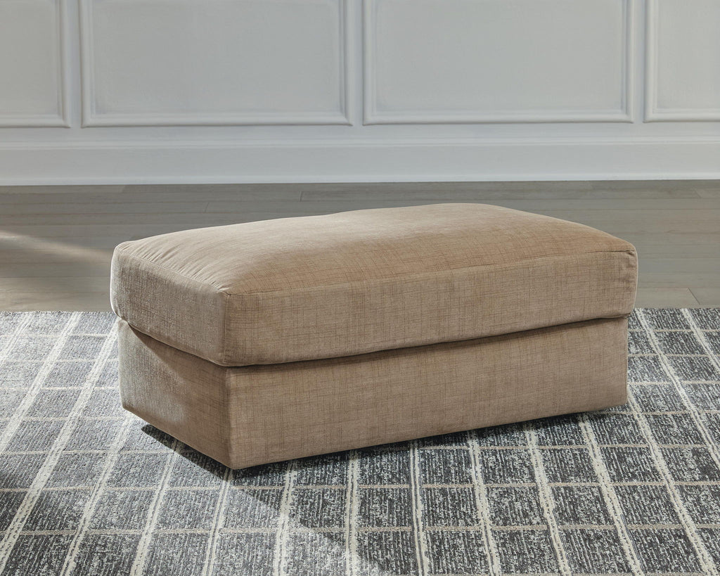 Honey-beige fabric ottoman, rounded top and chunky block base