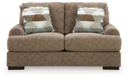 Medium brown loveseat sofa with two seat cushions, square arms, dark legs, patterned pillows