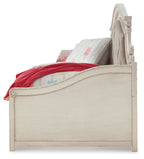 Twin day bed with storage, chipped white frame, curved footboard and headboard