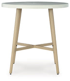 Beige round bar table underside with X-style cross brace and four legs