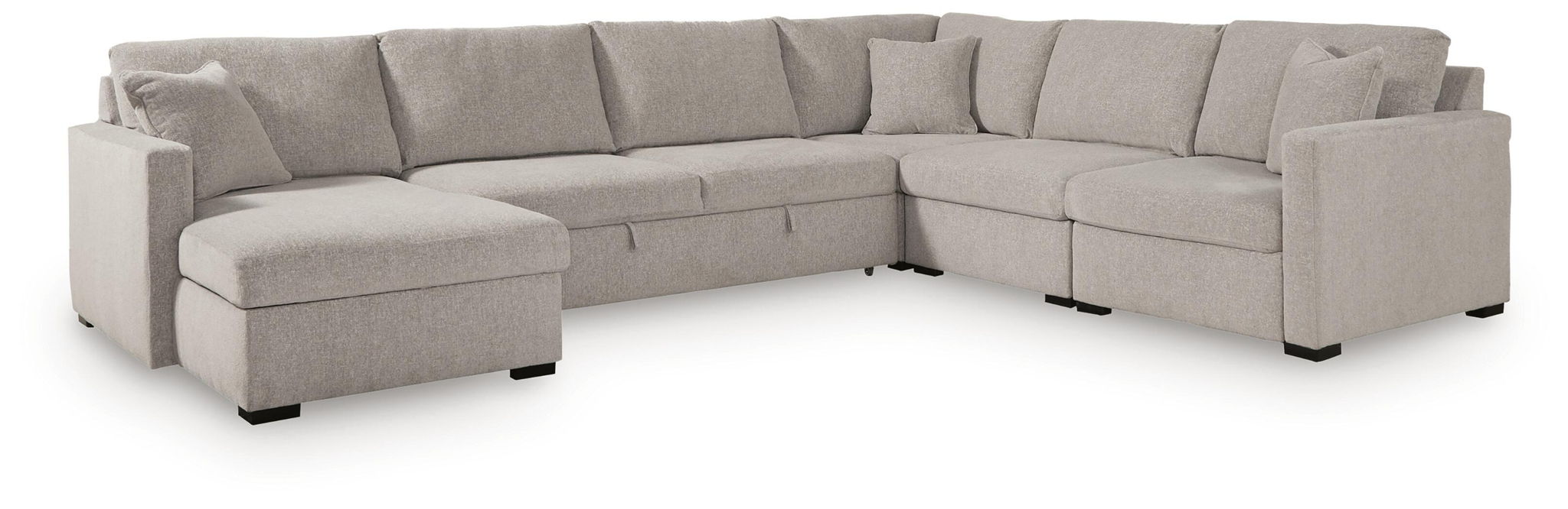 Gray sectional sofa with chaise ottoman, corner section, and multiple back cushions