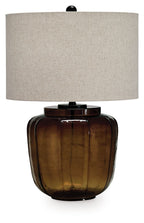 Amber glass table lamp with rounded base and beige fabric drum shade