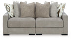 Pebble gray sectional sofa with back cushions and geometric accent pillows