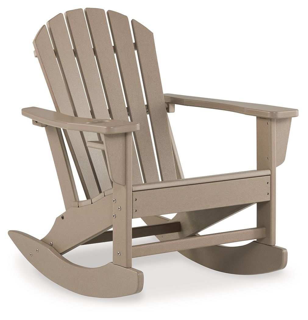 Light brown Adirondack rocking chair with slatted back, wide seat, and armrests.