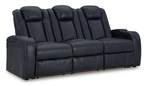 Power reclining sofa with adjustable headrests, dark navy leather-look upholstery