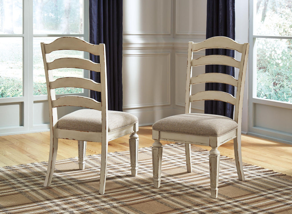 Pair of distressed white ladderback dining chairs with gray upholstered square seats