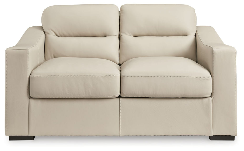 Almond loveseat with two front seat cushions, two back cushions, and padded arms