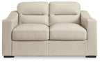 Almond loveseat with two front seat cushions, two back cushions, and padded arms