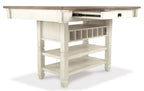 Beige rectangular dining counter table with open cubbies and two lower shelves