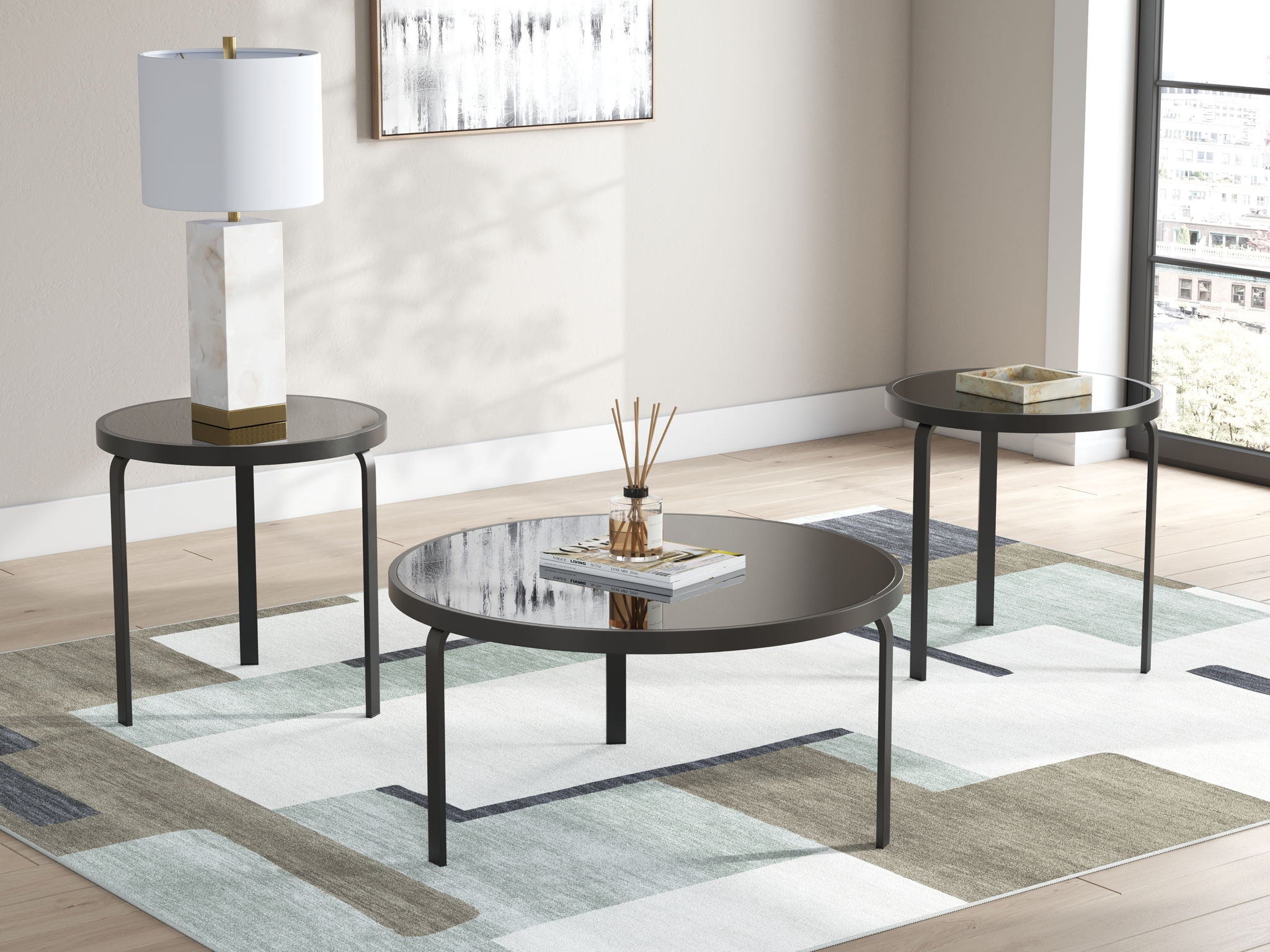 Black round occasional table set of 3 shown in living room, with dark metal legs