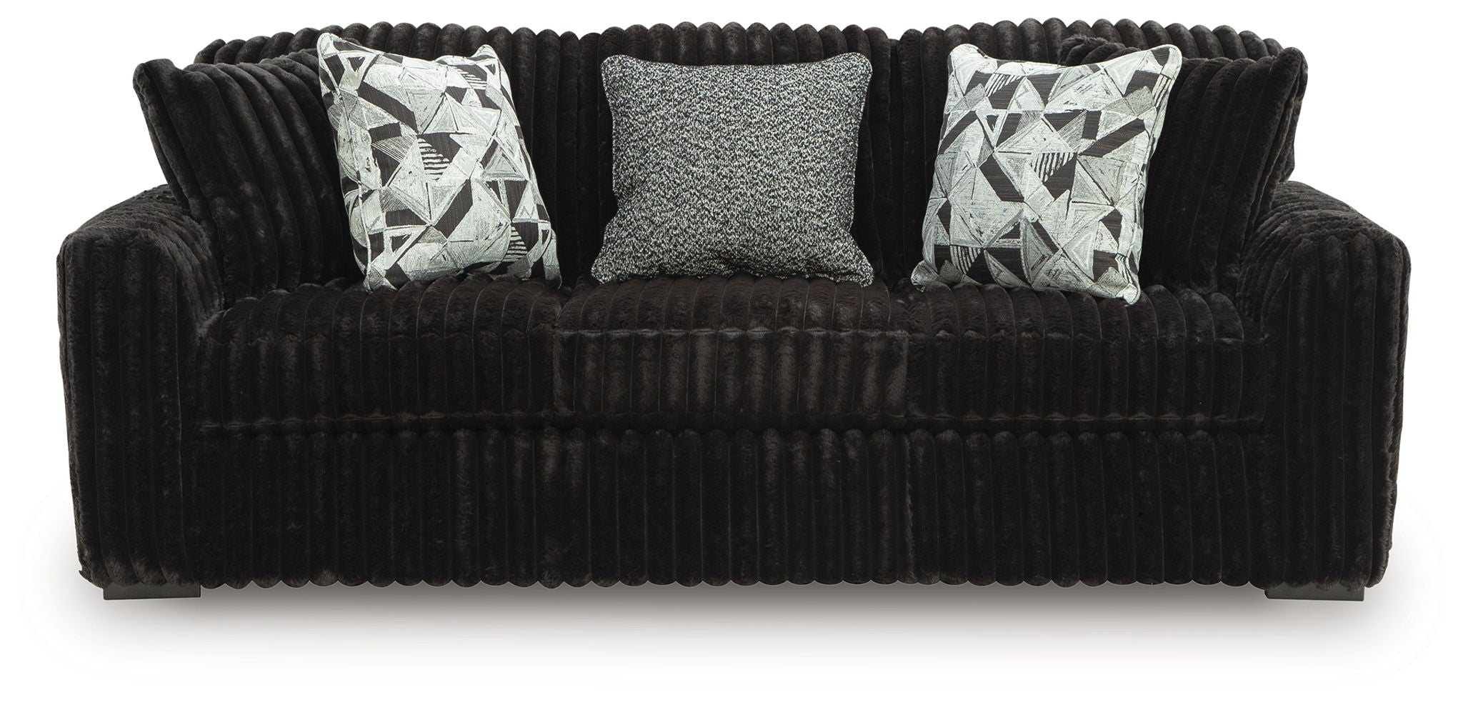 Dark sofa with corduroy fabric and three seat cushions; includes two patterned throw pillows.