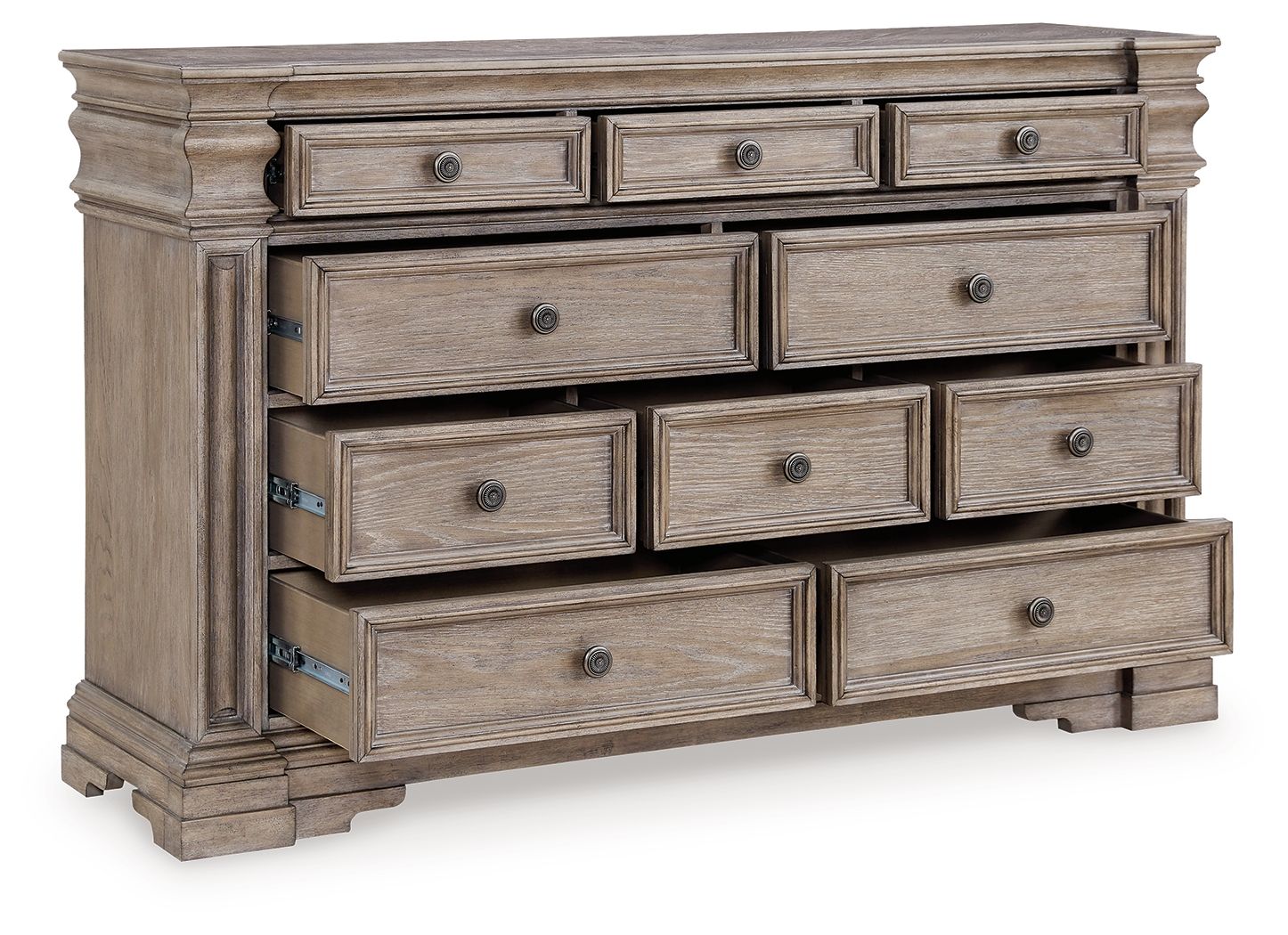 Light gray-brown dresser with layered drawers and round metal pulls, side view.