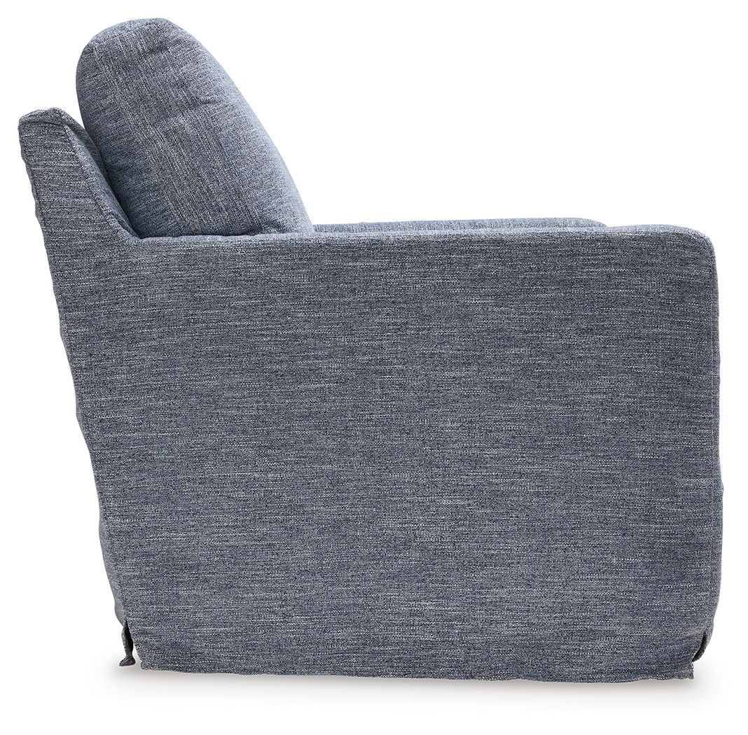 Blue upholstered swivel glider accent chair angled side view with tall back and arms