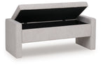 Gray storage bench with open hinged lid, black interior storage compartment