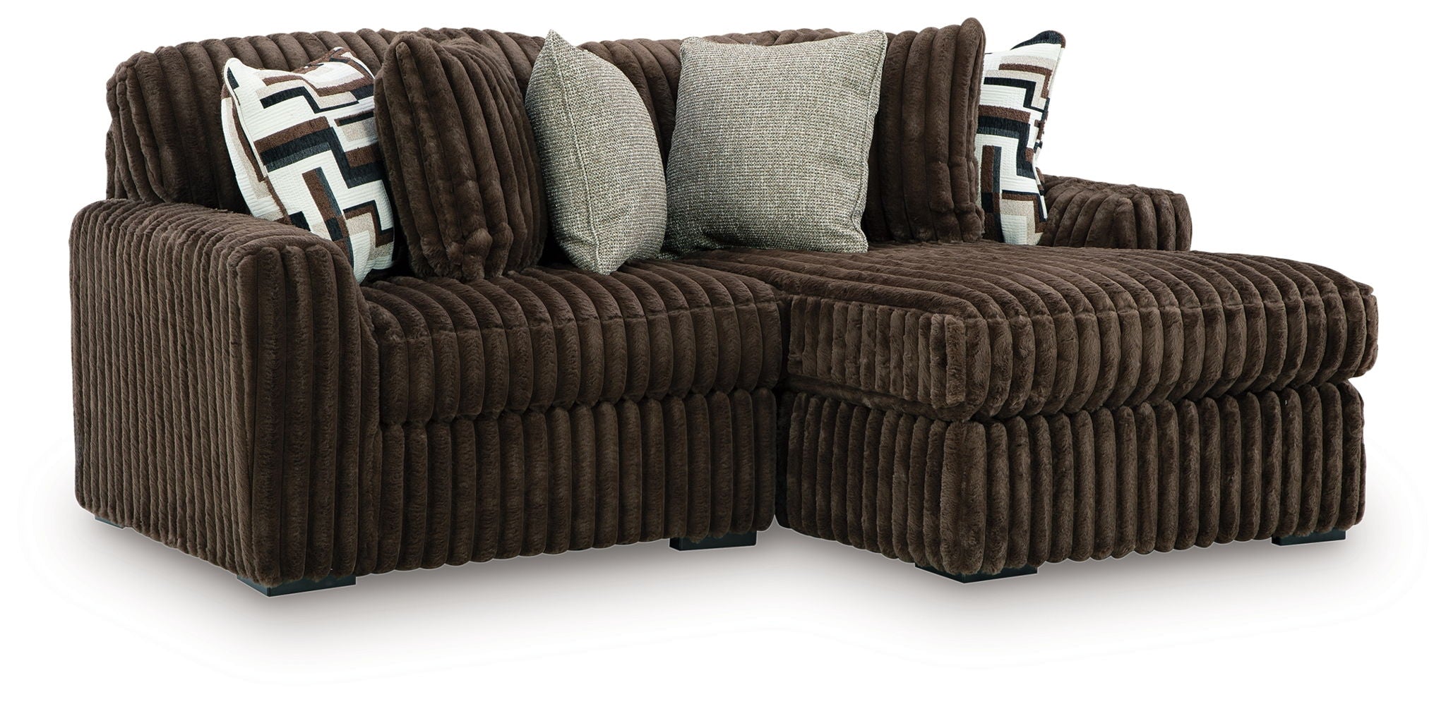 Sectional sofa with chaise, brown corded upholstery and patterned accent pillows